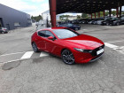 Mazda Mazda 3 occasion Rouge année 2020 boite Automatique Annonce Mazda Mazda 3 occasion Hybride 5 PORTES 2.0L SKYACTIV-G M Hybrid 122 ch BVA6 Sportline à VANNES